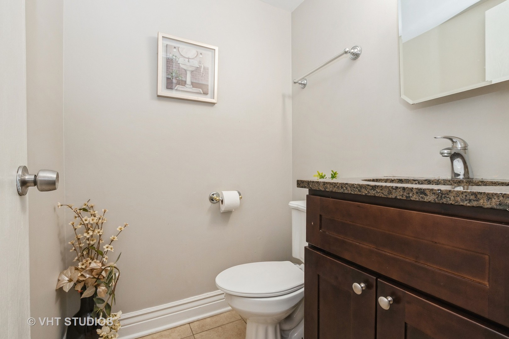 8036 Fawn Trail Justice, IL 60458 - Photo 8 of 16 a bathroom with a granite countertop toilet and a sink