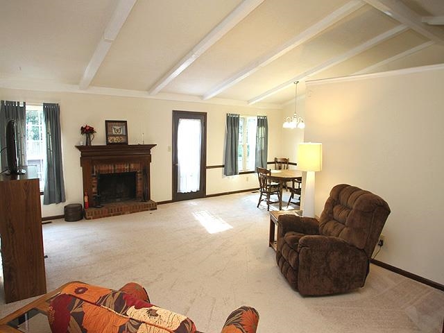 5408 Old Towne Road Raleigh, NC 27612 - Photo 3 of 18 a living room with furniture and a fireplace