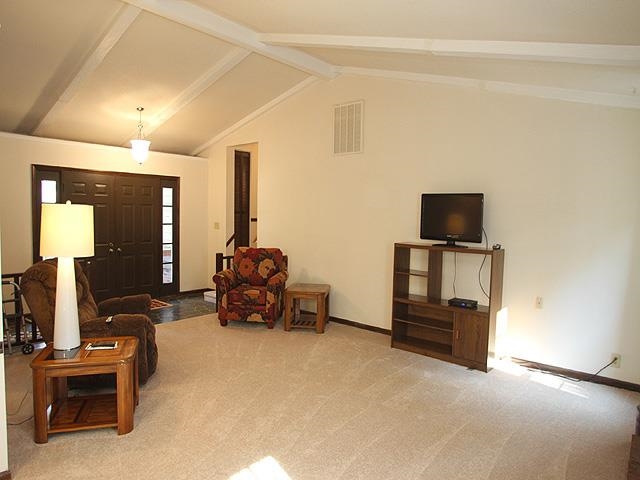 5408 Old Towne Road Raleigh, NC 27612 - Photo 4 of 18 a living room with furniture and a flat screen tv