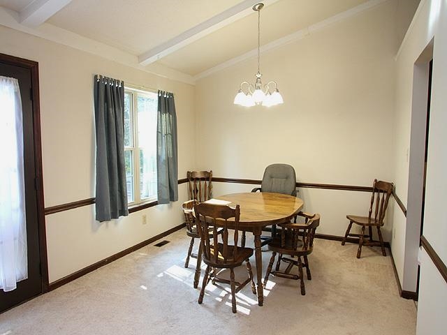 5408 Old Towne Road Raleigh, NC 27612 - Photo 5 of 18 a view of a dining room with furniture window and outside view