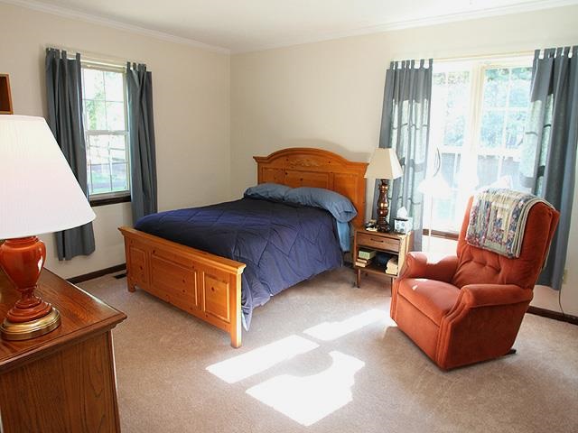 5408 Old Towne Road Raleigh, NC 27612 - Photo 9 of 18 a bedroom with furniture and a window