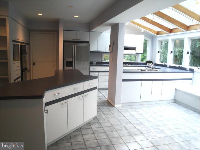 8908 Montpelier Drive Laurel, MD 20708 - Photo 2 of 23 Large kitchen addition with walls of windows