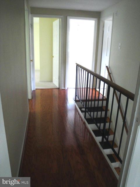 8908 Montpelier Drive Laurel, MD 20708 - Photo 14 of 23 Hardwood flooring on top level hallway