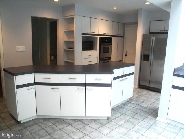 8908 Montpelier Drive Laurel, MD 20708 - Photo 5 of 23 Large island with plentiful storage, wine rack