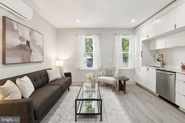 a living room with furniture and a window