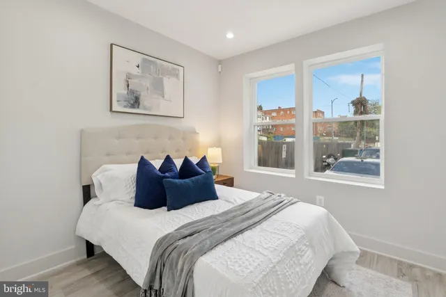 a bedroom with a large bed and a window