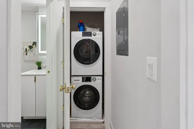 a view of a hallway with washer and dryer