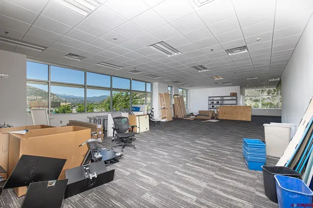 a view of a room that has a bed