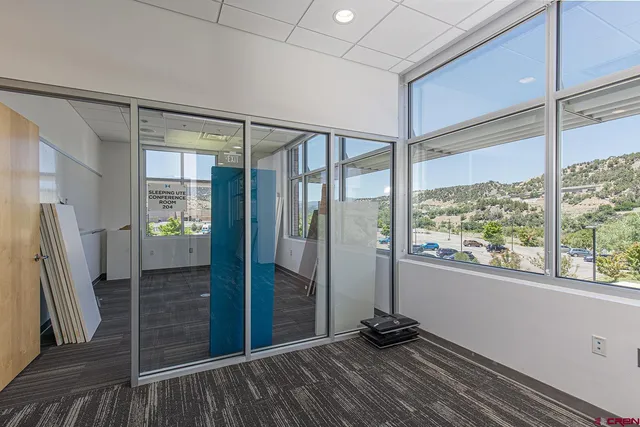 a room with gym equipment and a window