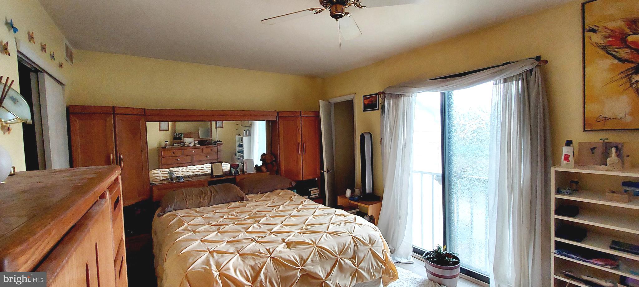 6 Via Cascata Drive Clementon, NJ 08021 - Photo 12 of 19 a bedroom with a bed and large windows