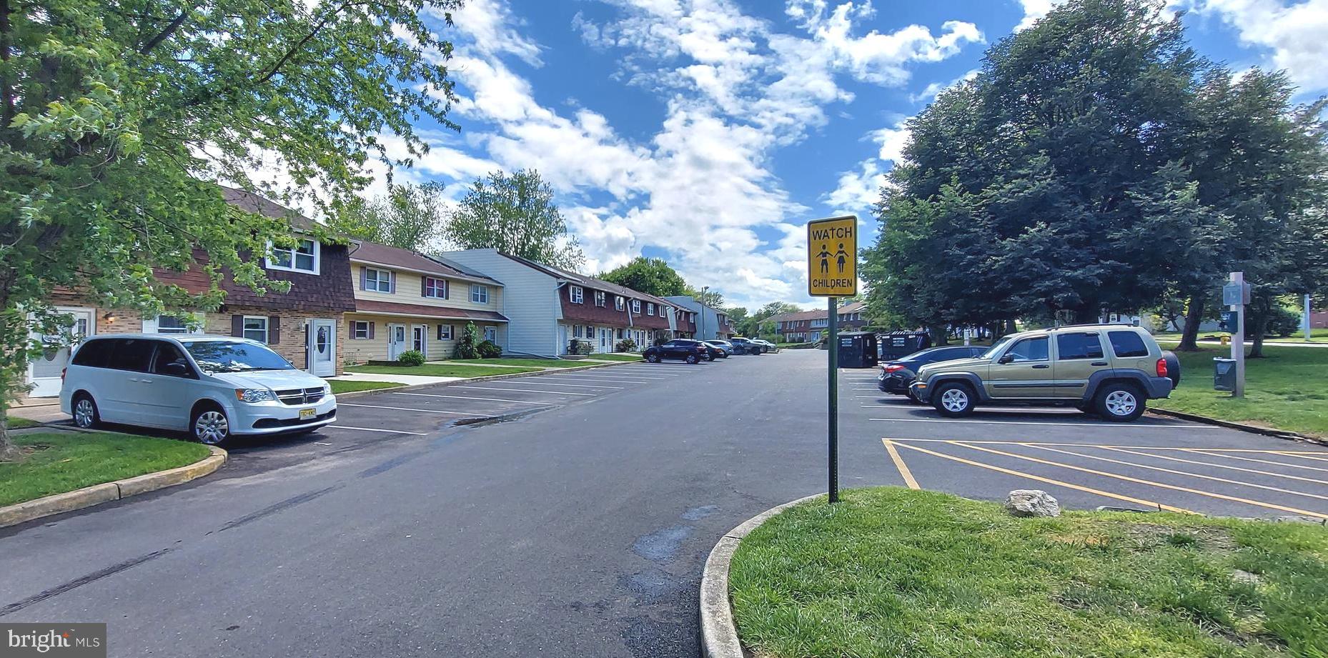 6 Via Cascata Drive Clementon, NJ 08021 - Photo 18 of 19 a front view of a house with a garden and parking space