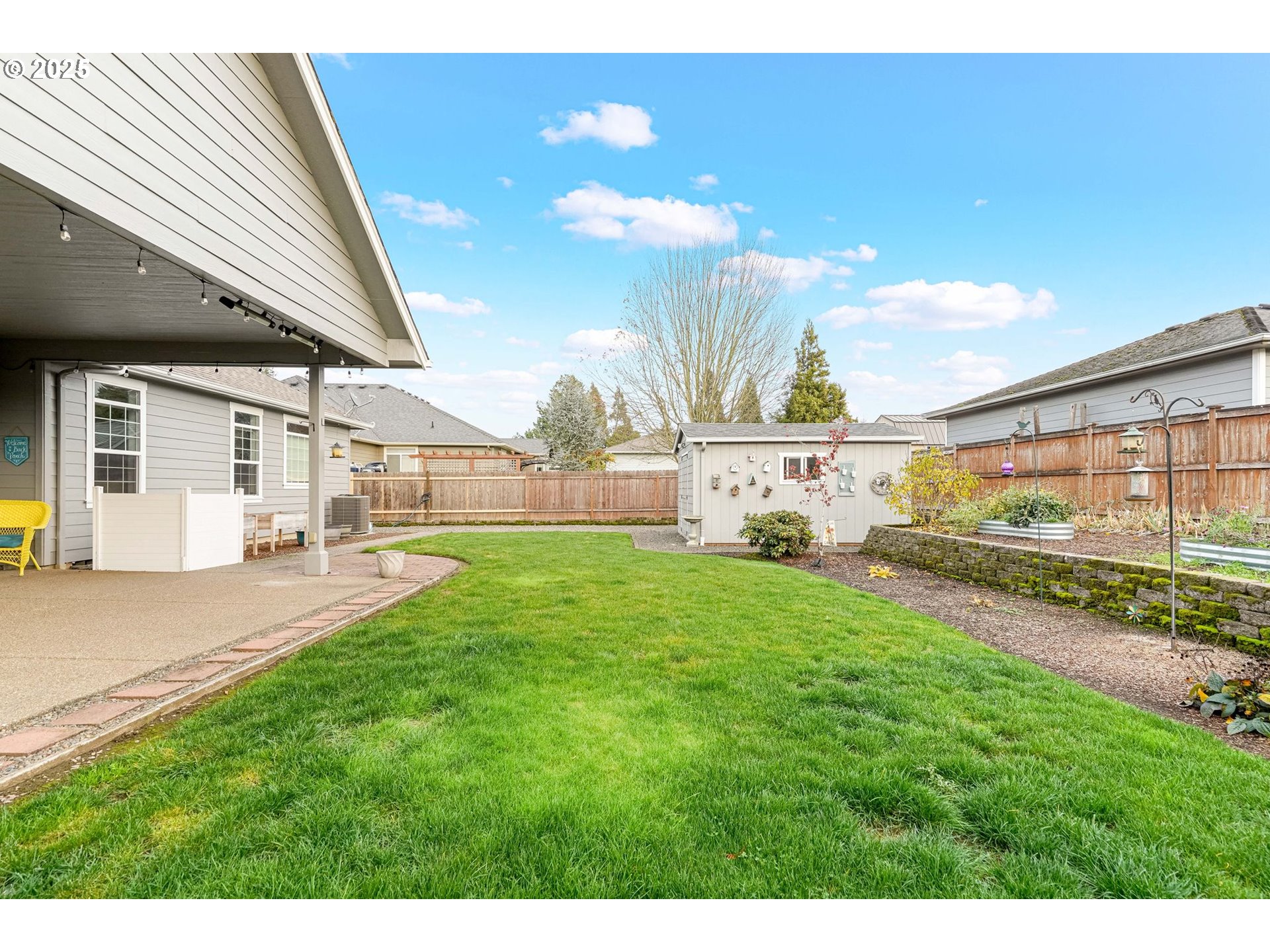 3208 54th Avenue Northeast Albany, OR 97321 - Photo 39 of 43 a view of backyard with a table and chairs