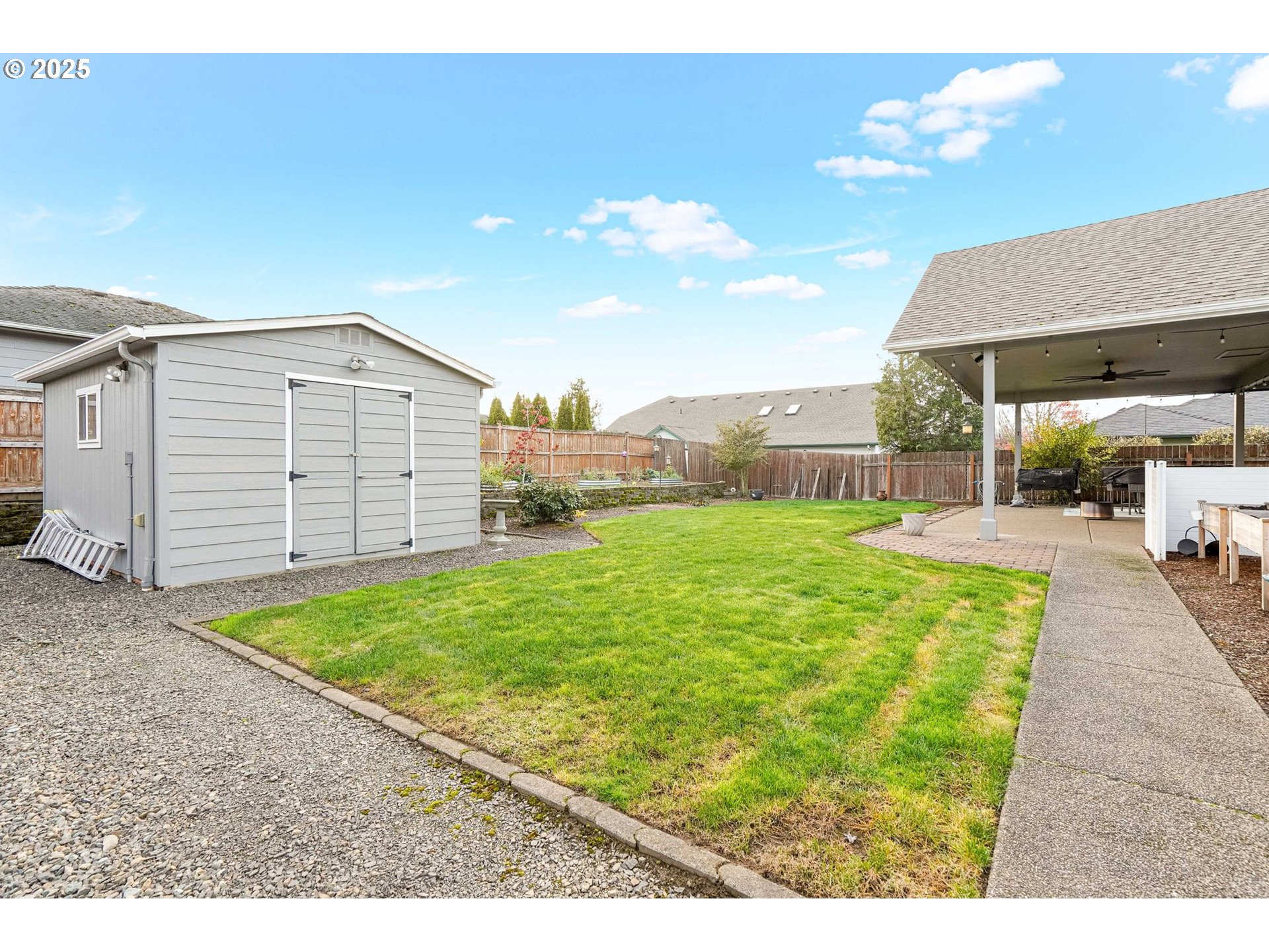 3208 54th Avenue Northeast Albany, OR 97321 - Photo 42 of 43 a view of a backyard with a garden and entertaining space