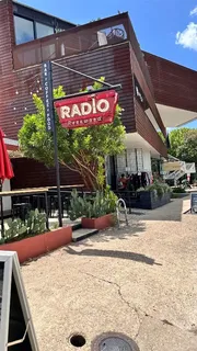a view of a chairs and table on the wooden deck