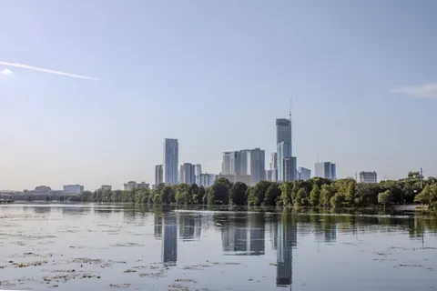 a view of a city with a lake