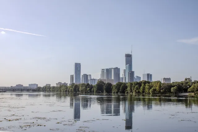a view of a city with a lake