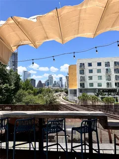 a view of a chairs and table in patio