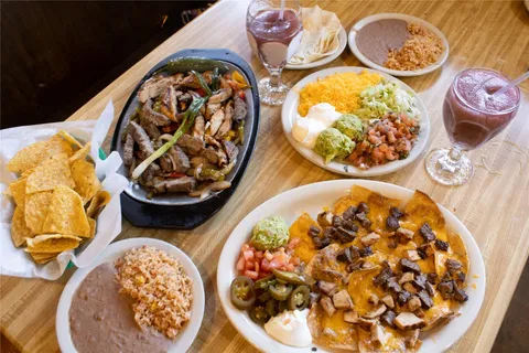 a view of a living room and balcony