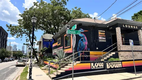 a dining room filled with furniture and chandelier