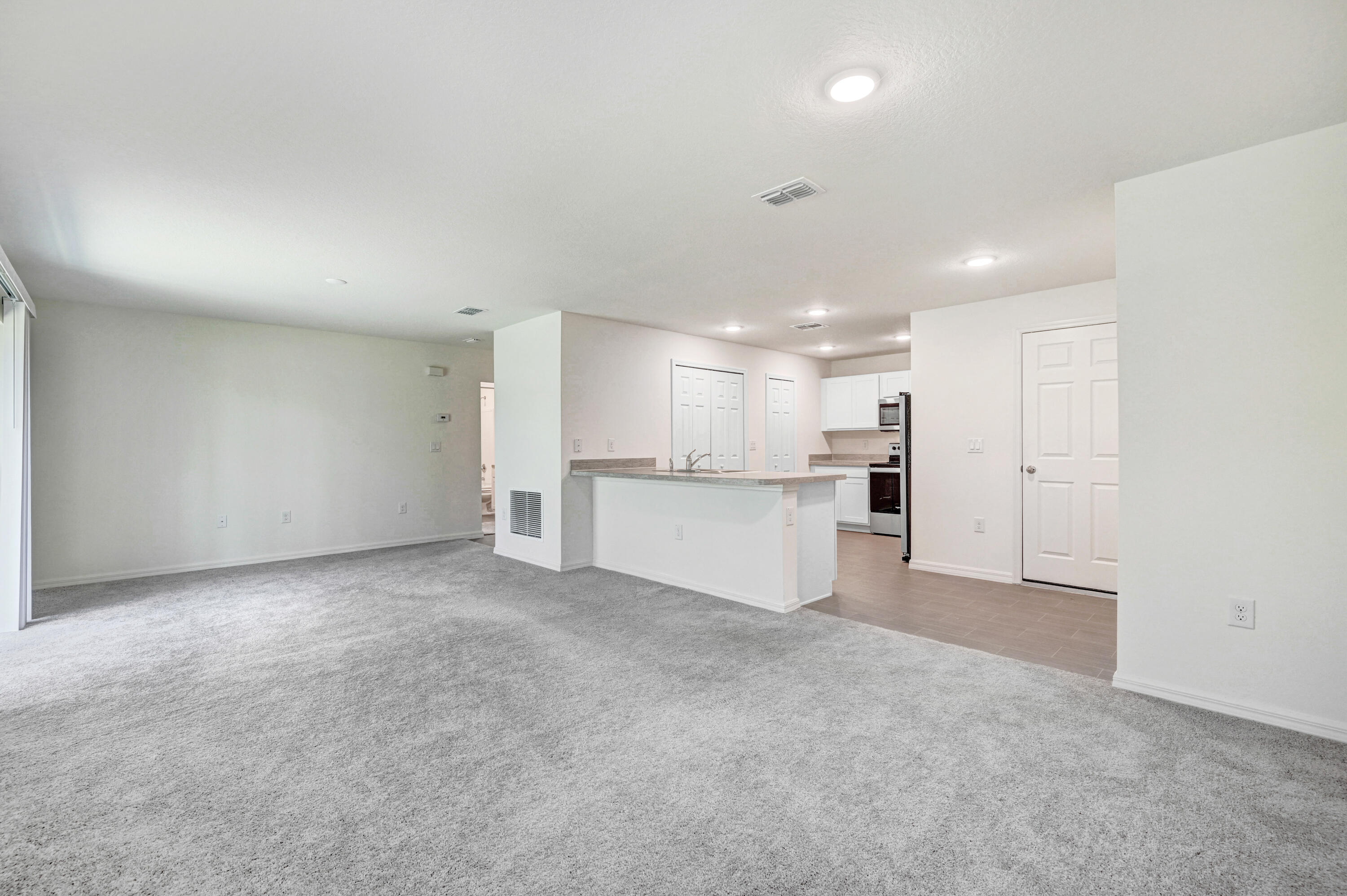 2568 Degroodt Road Southwest Palm Bay, FL 32908 - Photo 8 of 26 Family/Dining looks into Kitchen