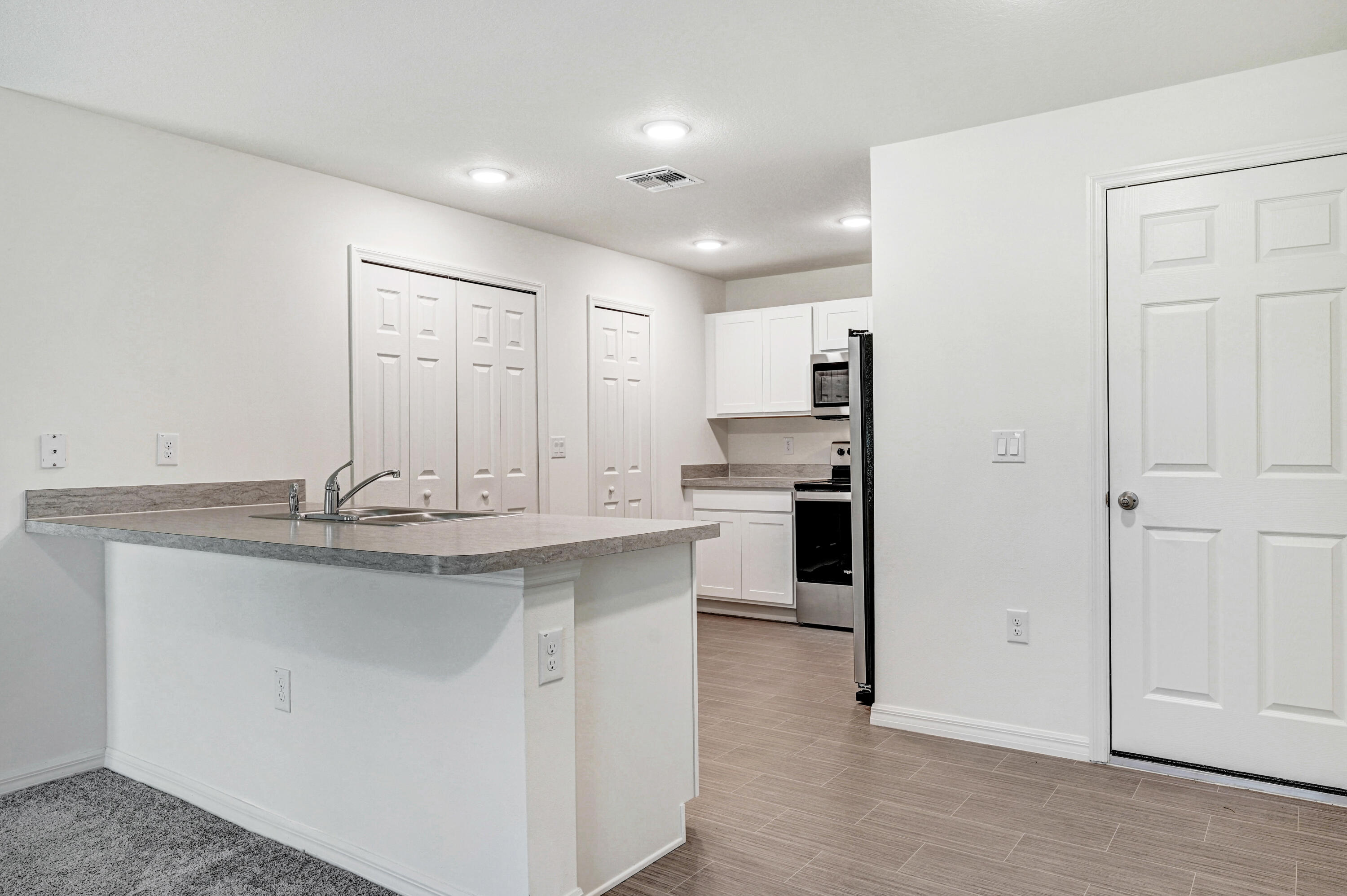 2568 Degroodt Road Southwest Palm Bay, FL 32908 - Photo 9 of 26 Breakfast Bar overlooks Kitchen