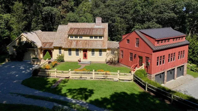 an aerial view of residential houses with yard