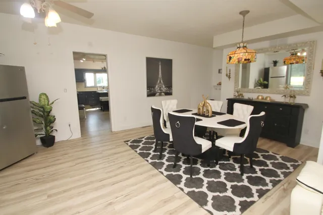 a dining room with a table and chairs