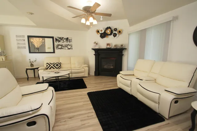 a living room with furniture and a fireplace