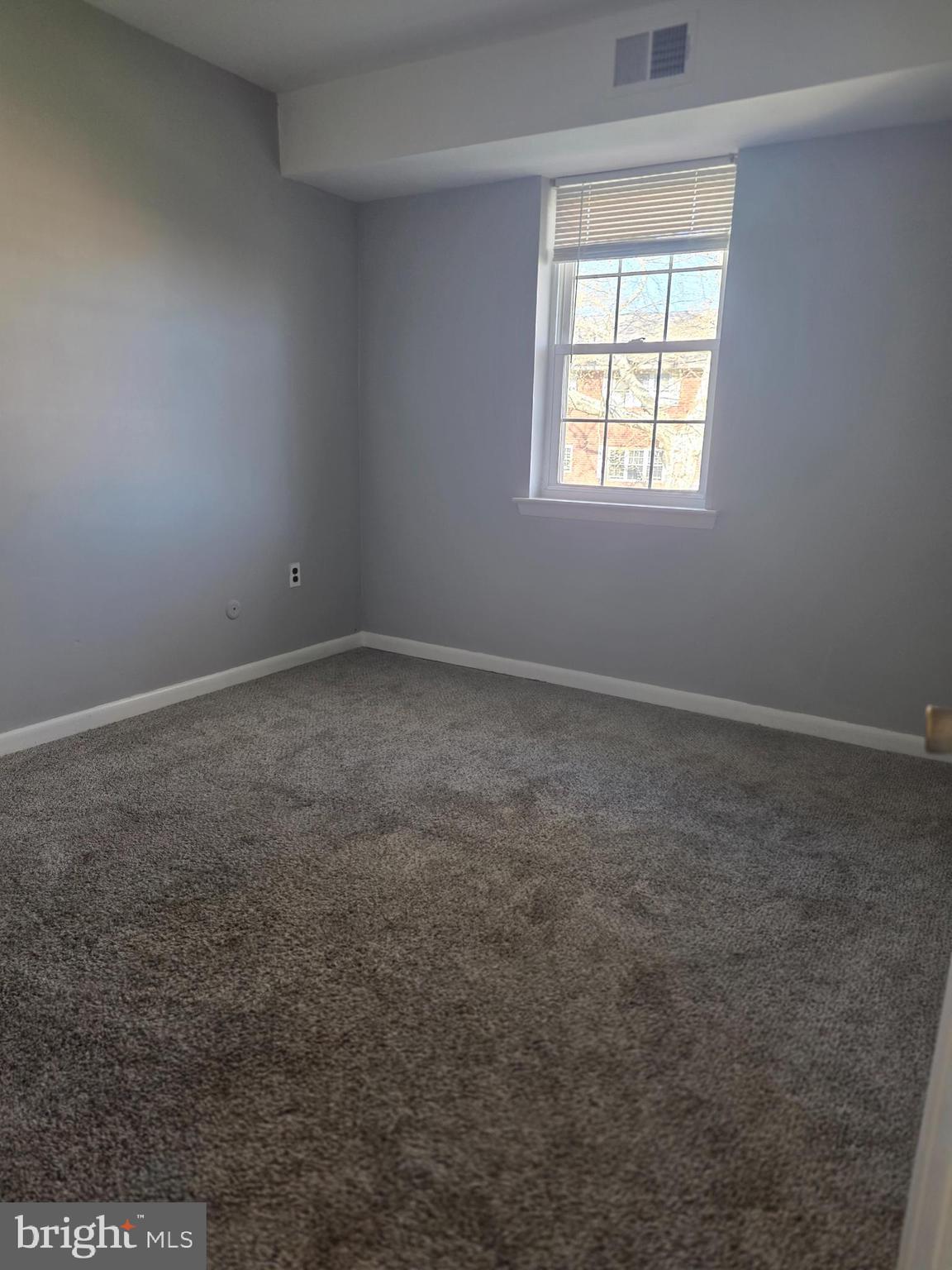 806 South Avenue, Unit E9 Secane, PA 19018 - Photo 12 of 17 an empty room with a window
