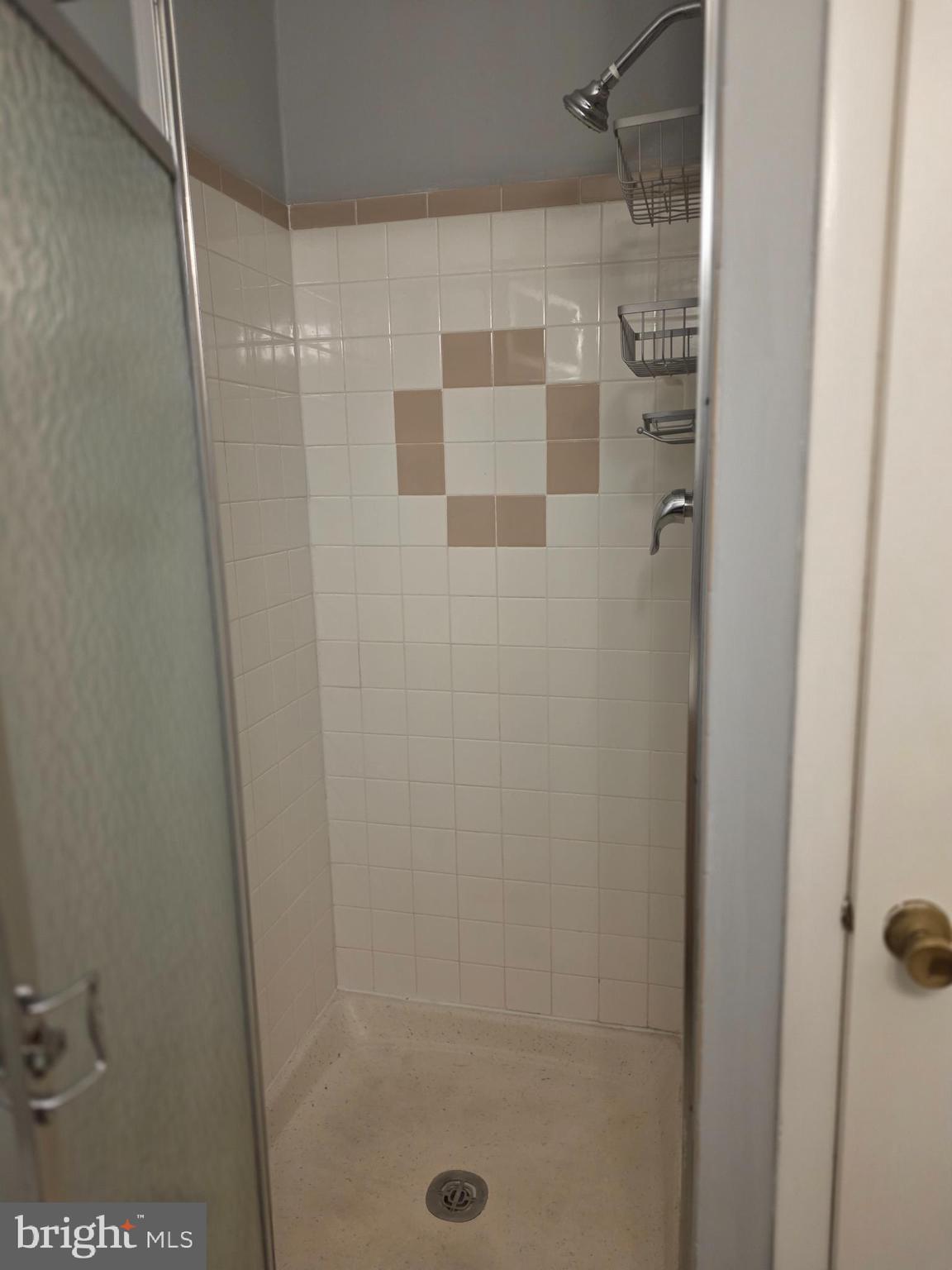 806 South Avenue, Unit E9 Secane, PA 19018 - Photo 17 of 17 a bathroom with a shower
