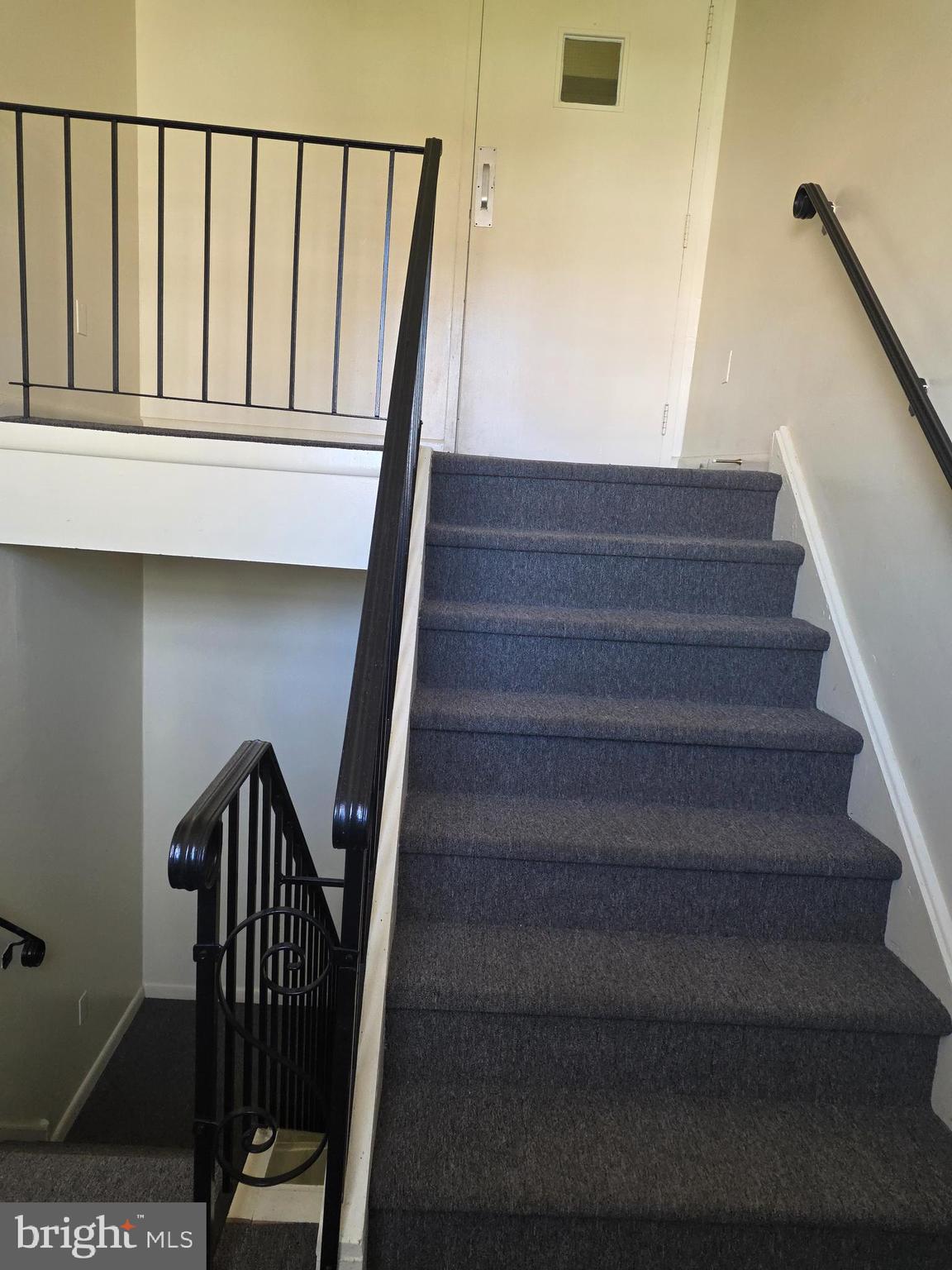 806 South Avenue, Unit E9 Secane, PA 19018 - Photo 5 of 17 a view of staircase with railing and white walls