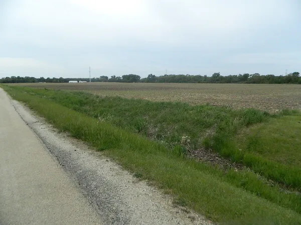 a view of a lake with a big yard