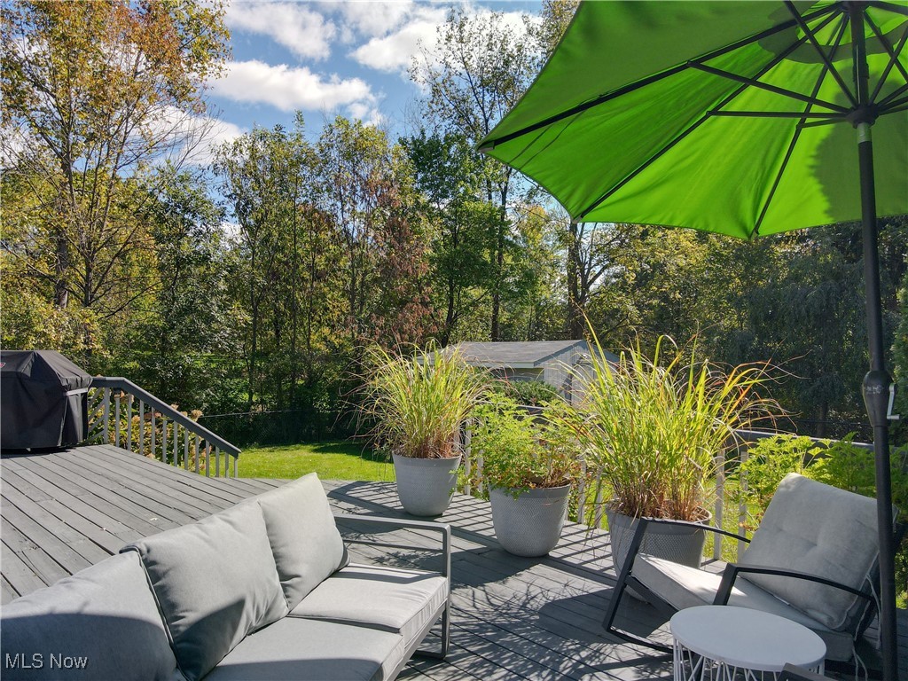 35600 Bainbridge Road Solon, OH 44139 - Photo 13 of 18 View of deck with an outdoor living space opens to huge backyard