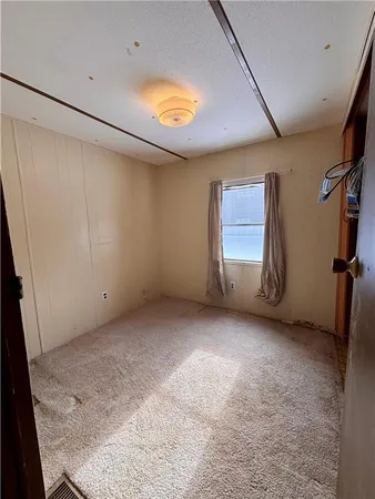 a view of room with window and stairs