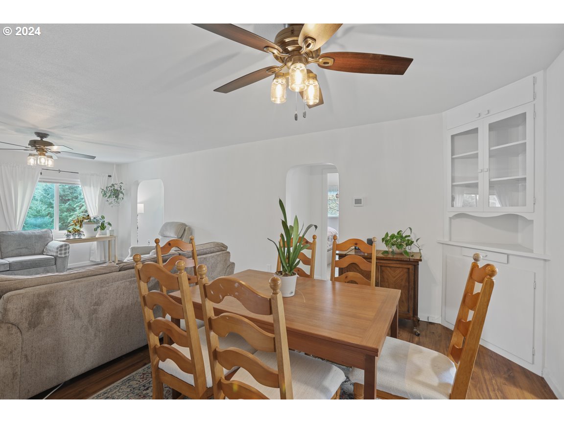 32997 Sykes Road St. Helens, OR 97051 - Photo 11 of 44 a view of a dining room with furniture and wooden floor