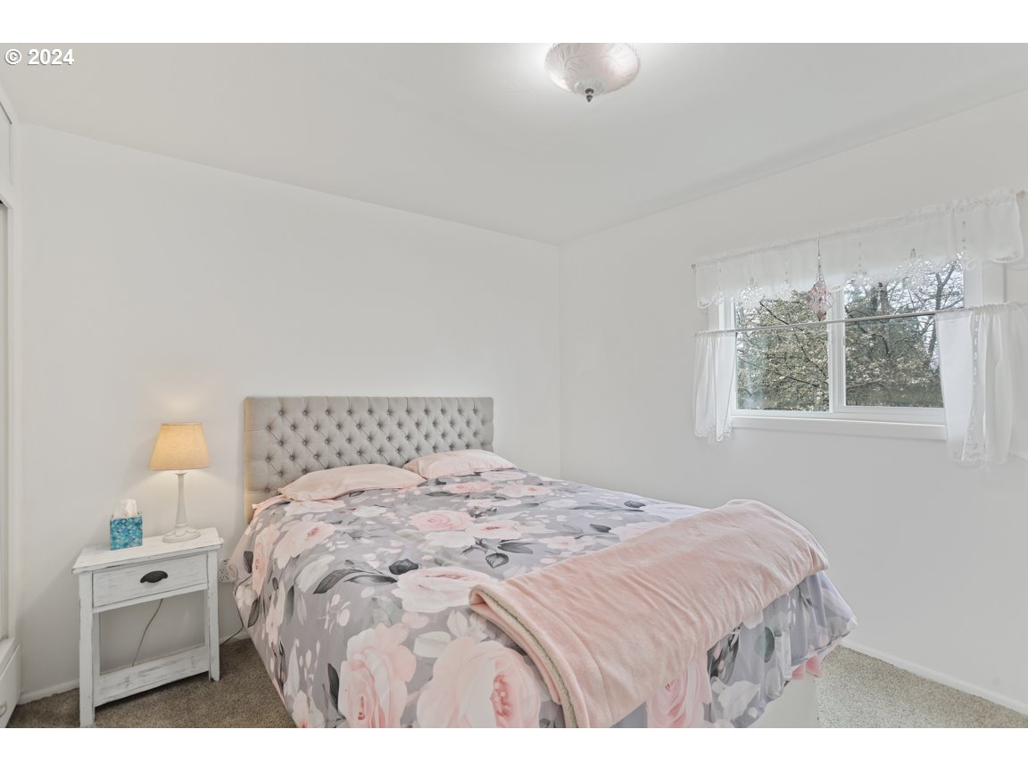 32997 Sykes Road St. Helens, OR 97051 - Photo 17 of 44 a bedroom with a bed and a window
