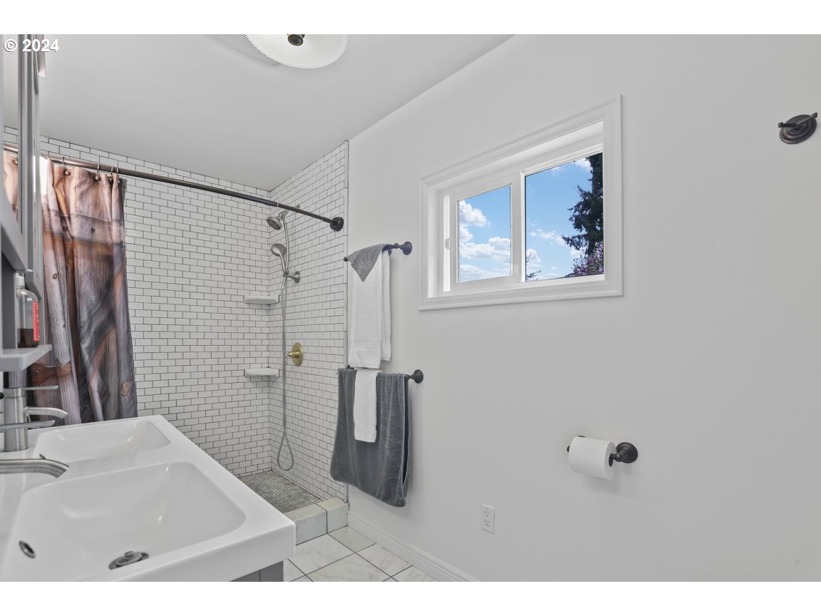 32997 Sykes Road St. Helens, OR 97051 - Photo 20 of 44 a bathroom with a sink and a mirror