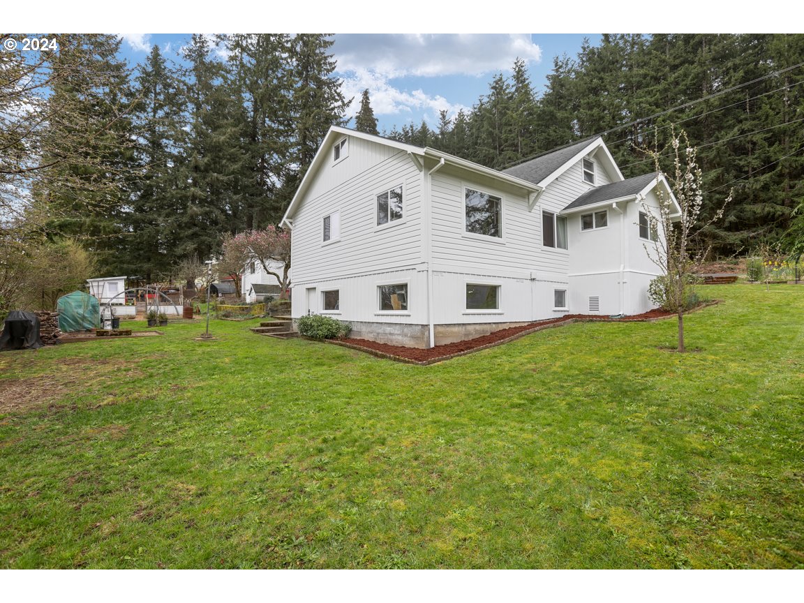 32997 Sykes Road St. Helens, OR 97051 - Photo 34 of 44 a view of a house with a yard