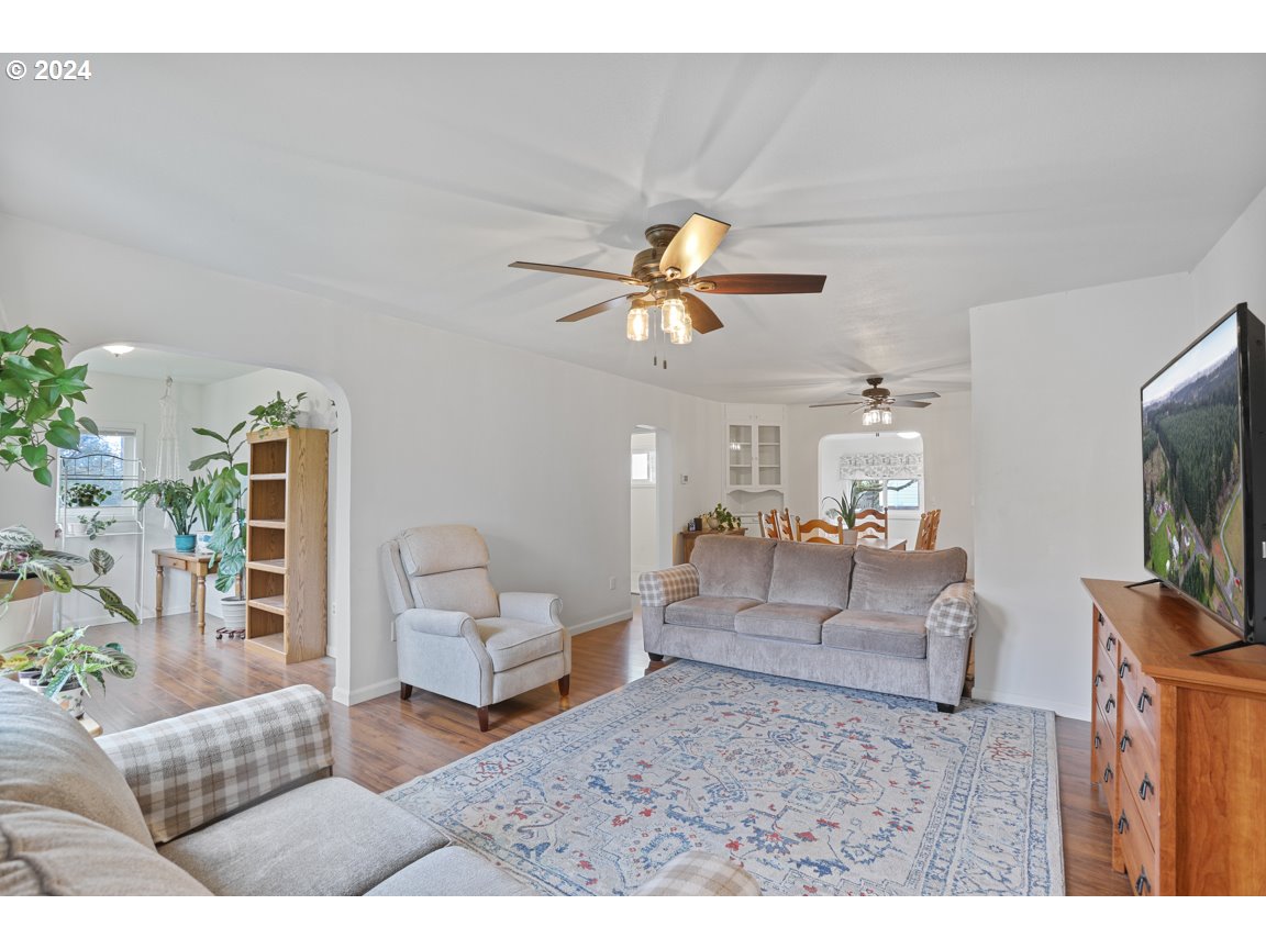 32997 Sykes Road St. Helens, OR 97051 - Photo 5 of 44 a living room with furniture and a flat screen tv