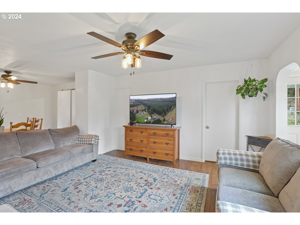 32997 Sykes Road St. Helens, OR 97051 - Photo 7 of 44 a living room with furniture and a ceiling fan