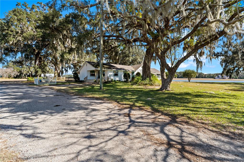 9504 Fort King Road Dade City, FL 33525 - Photo 46 of 51 a view of a house with a big yard