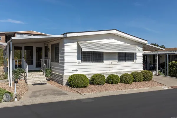 a front view of a house with a garage