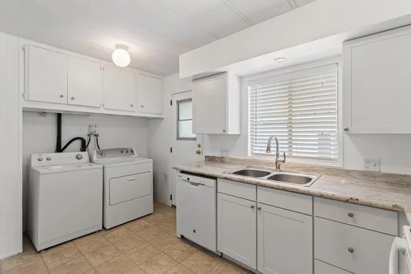 a kitchen with a sink and cabinets