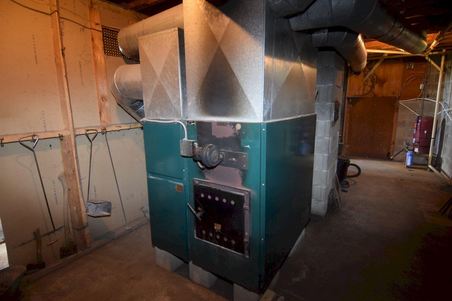 182 Sterry Hill Road Starks, ME 04911 - Photo 59 of 115 basement - multi-fuel furnace