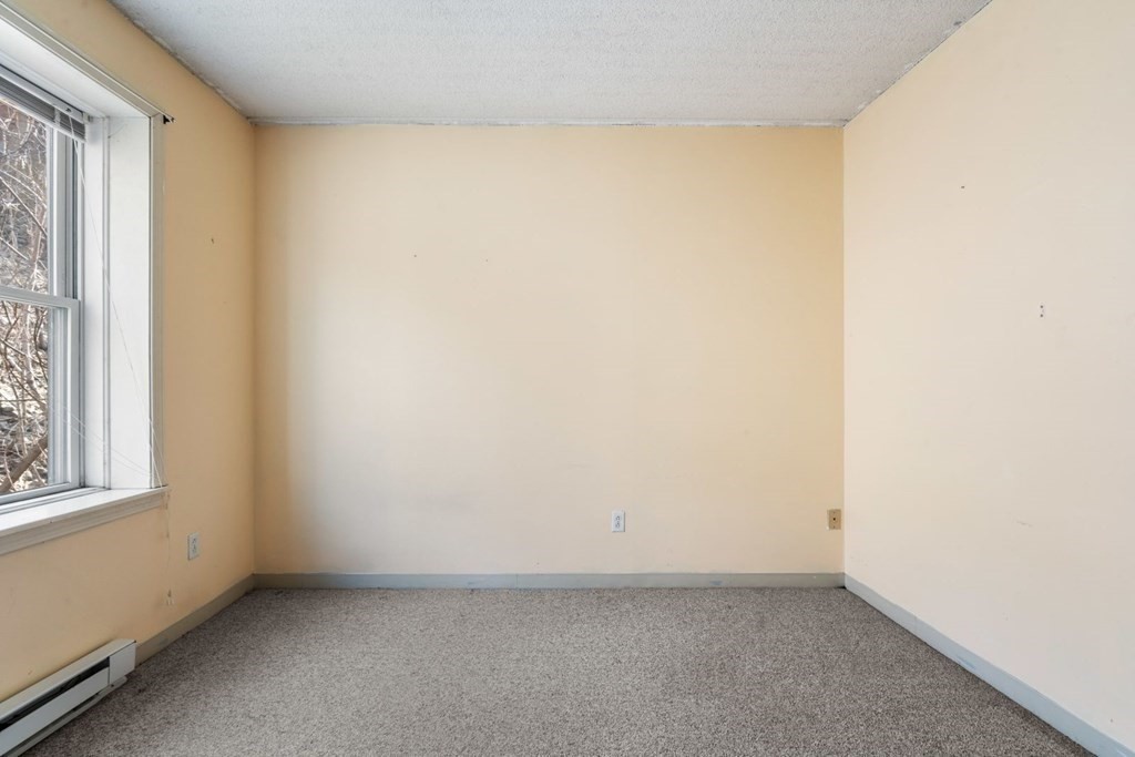 5 B Eileen Circle, Unit 11 Boston, MA 02130 - Photo 11 of 19 an empty room with a window