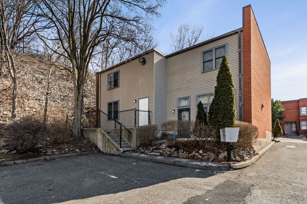 5 B Eileen Circle, Unit 11 Boston, MA 02130 - Photo 19 of 19 a front view of a house with garden