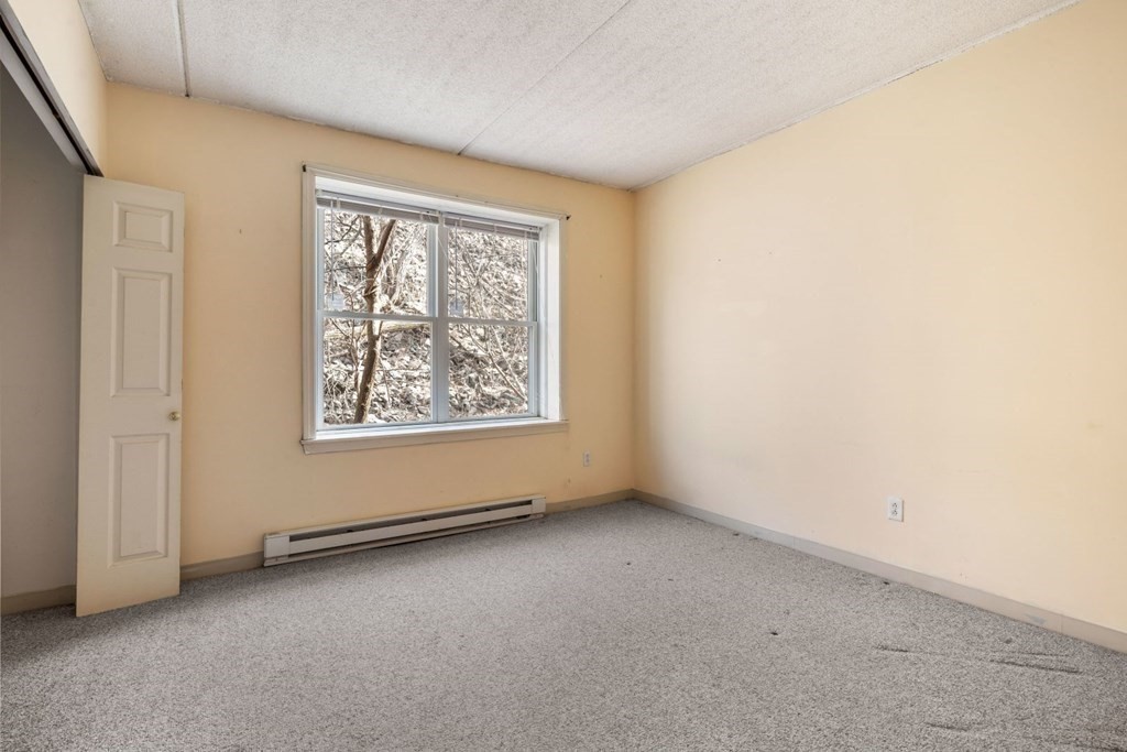 5 B Eileen Circle, Unit 11 Boston, MA 02130 - Photo 9 of 19 an empty room with windows