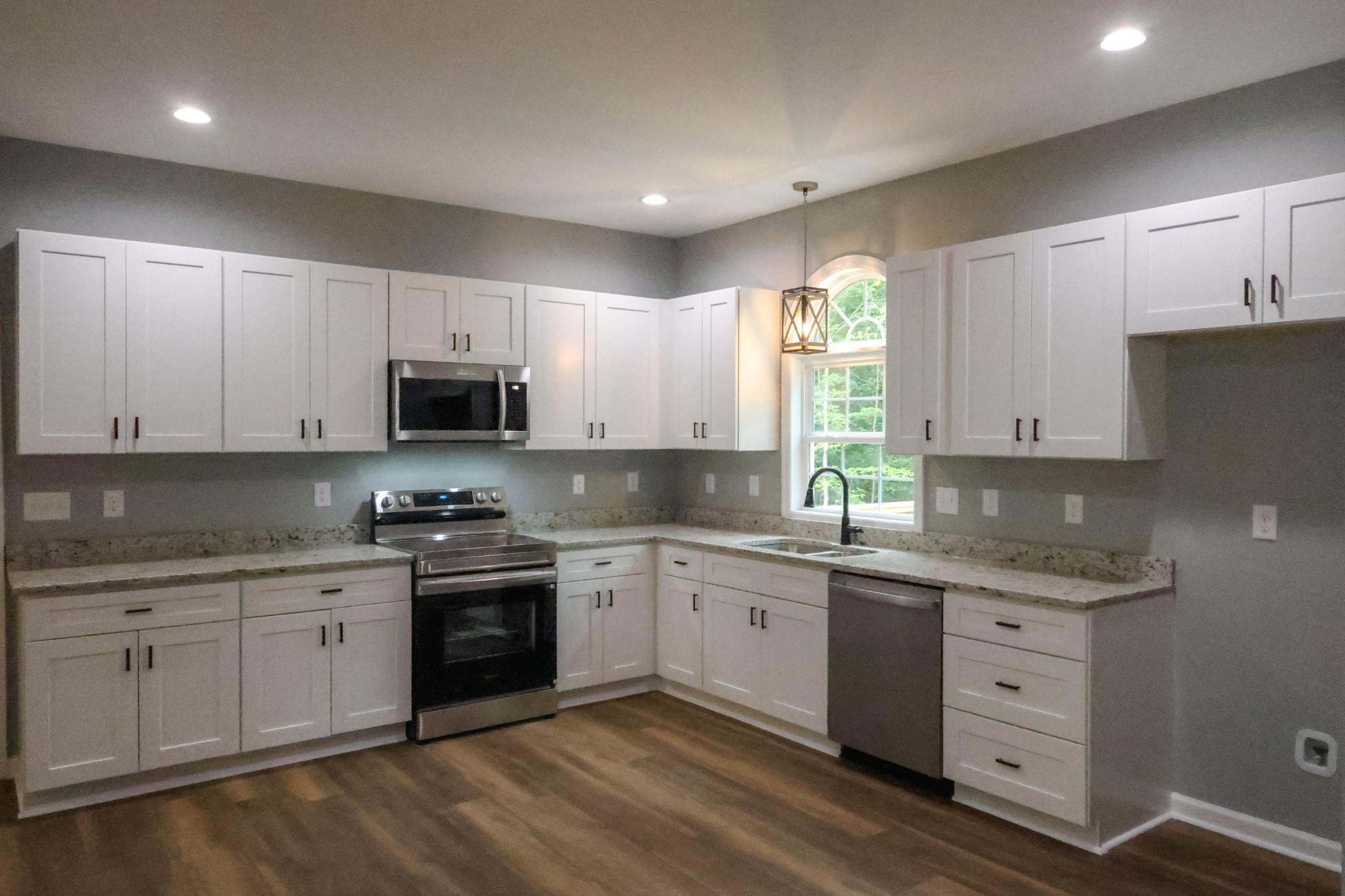161 Vista Pointe Hohenwald, TN 38462 - Photo 11 of 43 a kitchen with a sink a window and cabinets