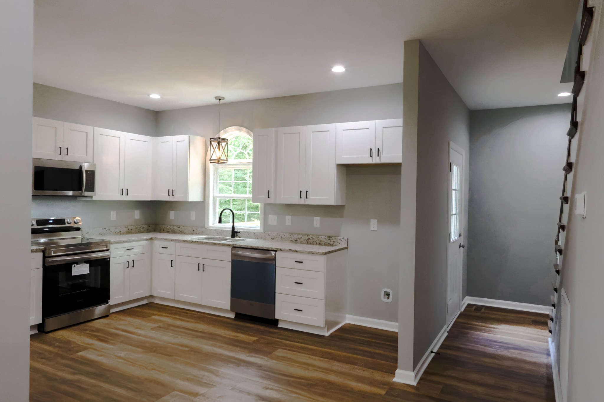 161 Vista Pointe Hohenwald, TN 38462 - Photo 12 of 43 a kitchen with a stove a sink and a microwave