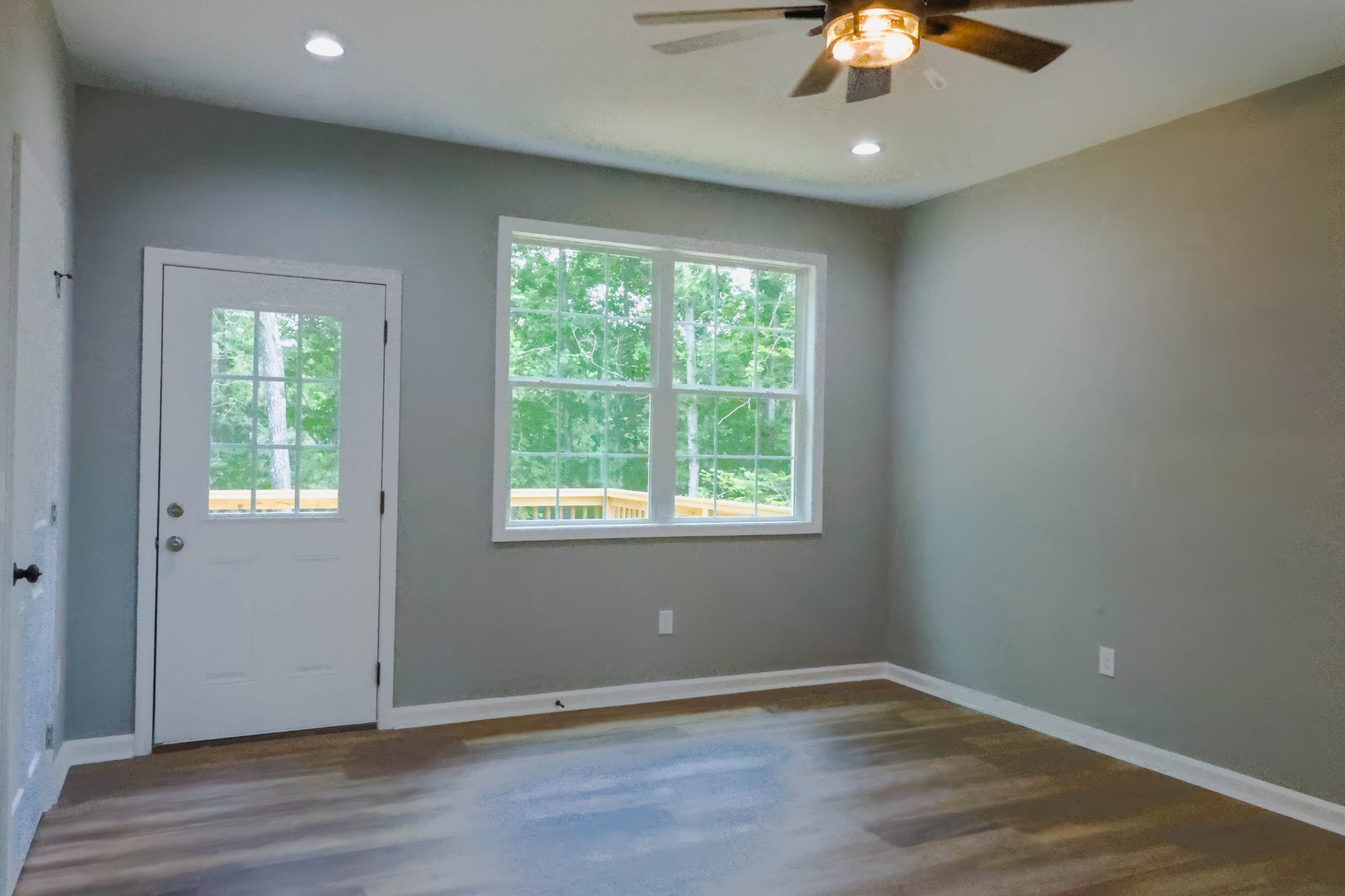 161 Vista Pointe Hohenwald, TN 38462 - Photo 17 of 43 an empty room with wooden floor and chandelier fan
